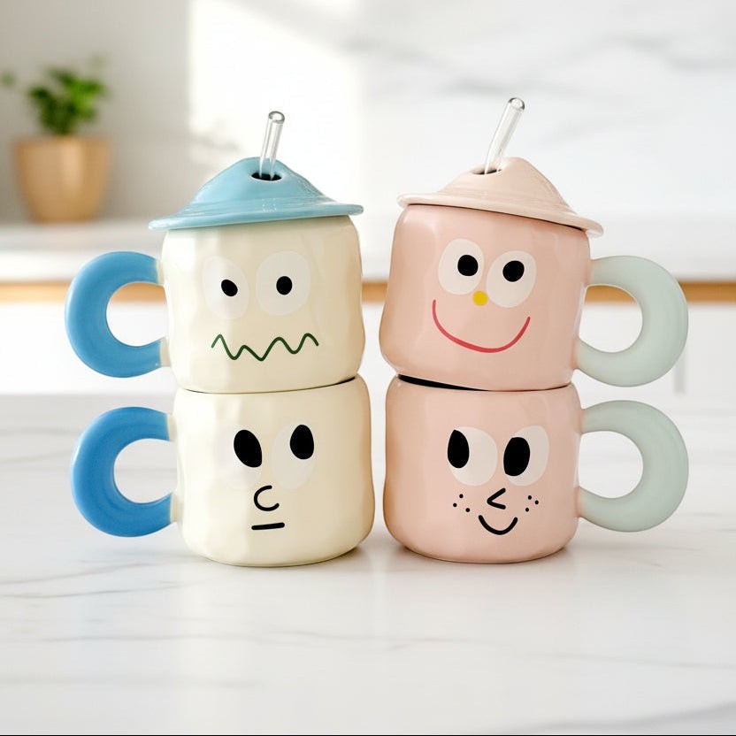 Keeyos PH Bloop Cup ceramic mugs with lids and straws, featuring cute cartoon faces in blue and pink.