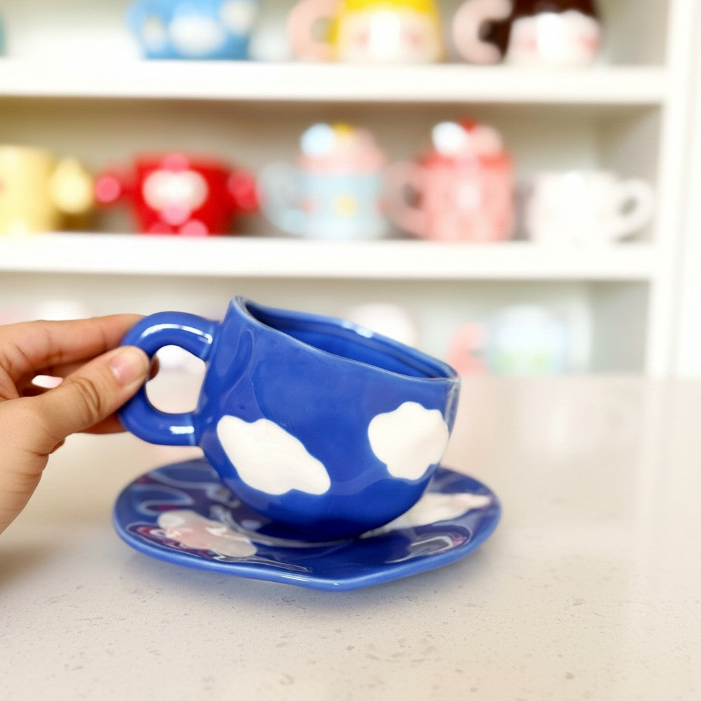 Keeyos PH Chunky Cloud Dark Blue Cup and Saucer Set with white cloud design. Ceramic material.
