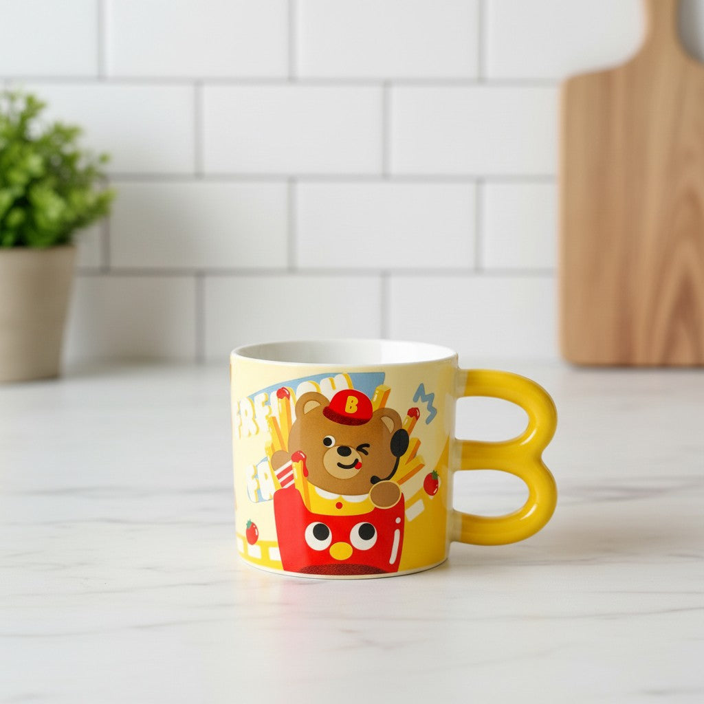 Keeyos PH yellow mug with cute cartoon bear eating french fries design and a bright yellow handle.