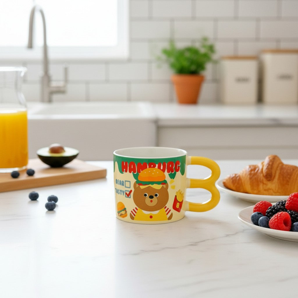 Keeyos PH yellow mug with a cute bear wearing a hamburger and french fries graphic, perfect for coffee or tea.