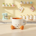 Keeyos PH ceramic Happy Feet Cup with a smiling face and orange feet on a wooden kitchen counter