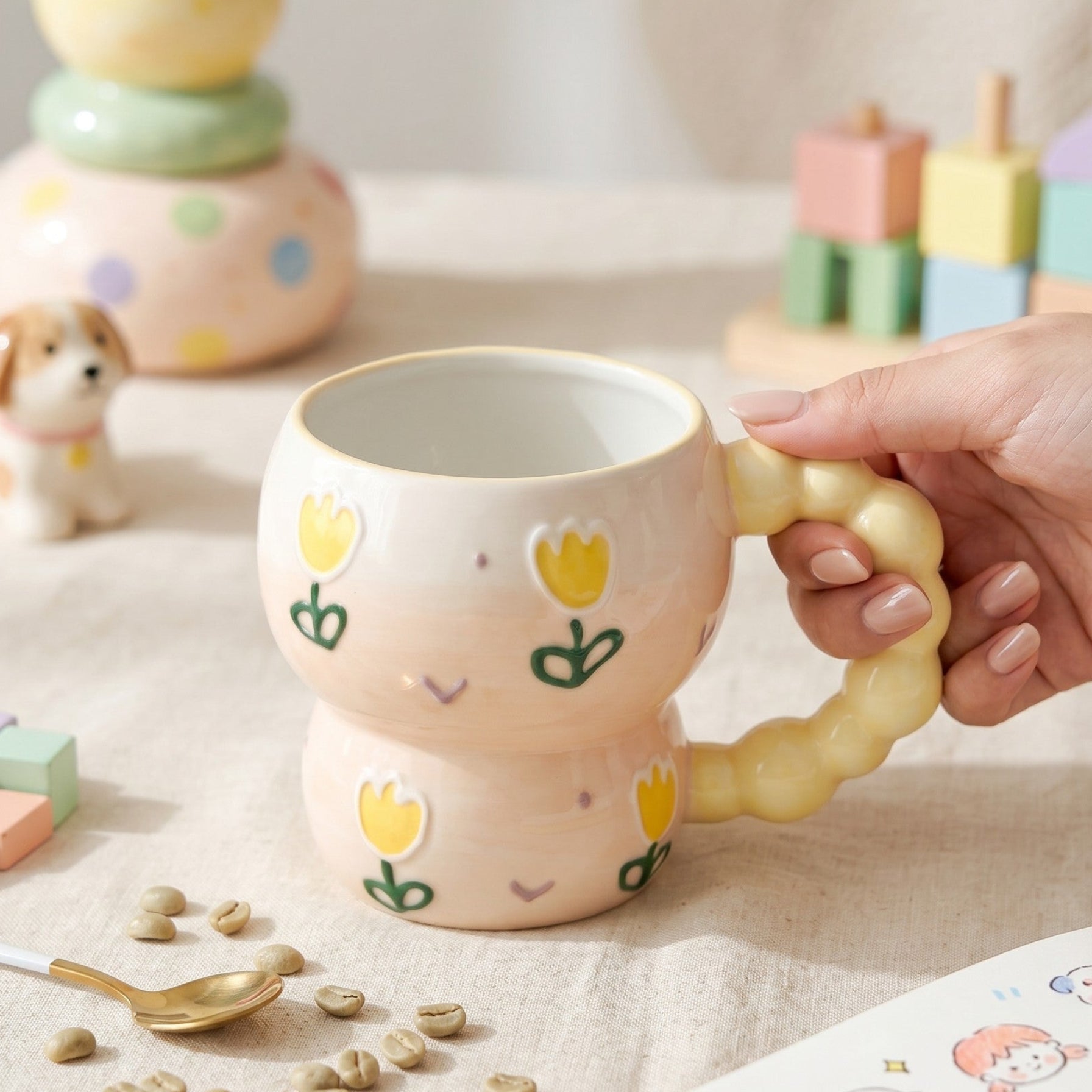 Keeyos PH hand-painted ceramic mug with pastel pink base, yellow tulips, and puffy yellow handle.